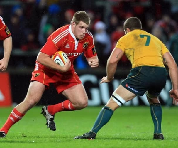 Pete Borlase carrying the ball during his professional rugby days.