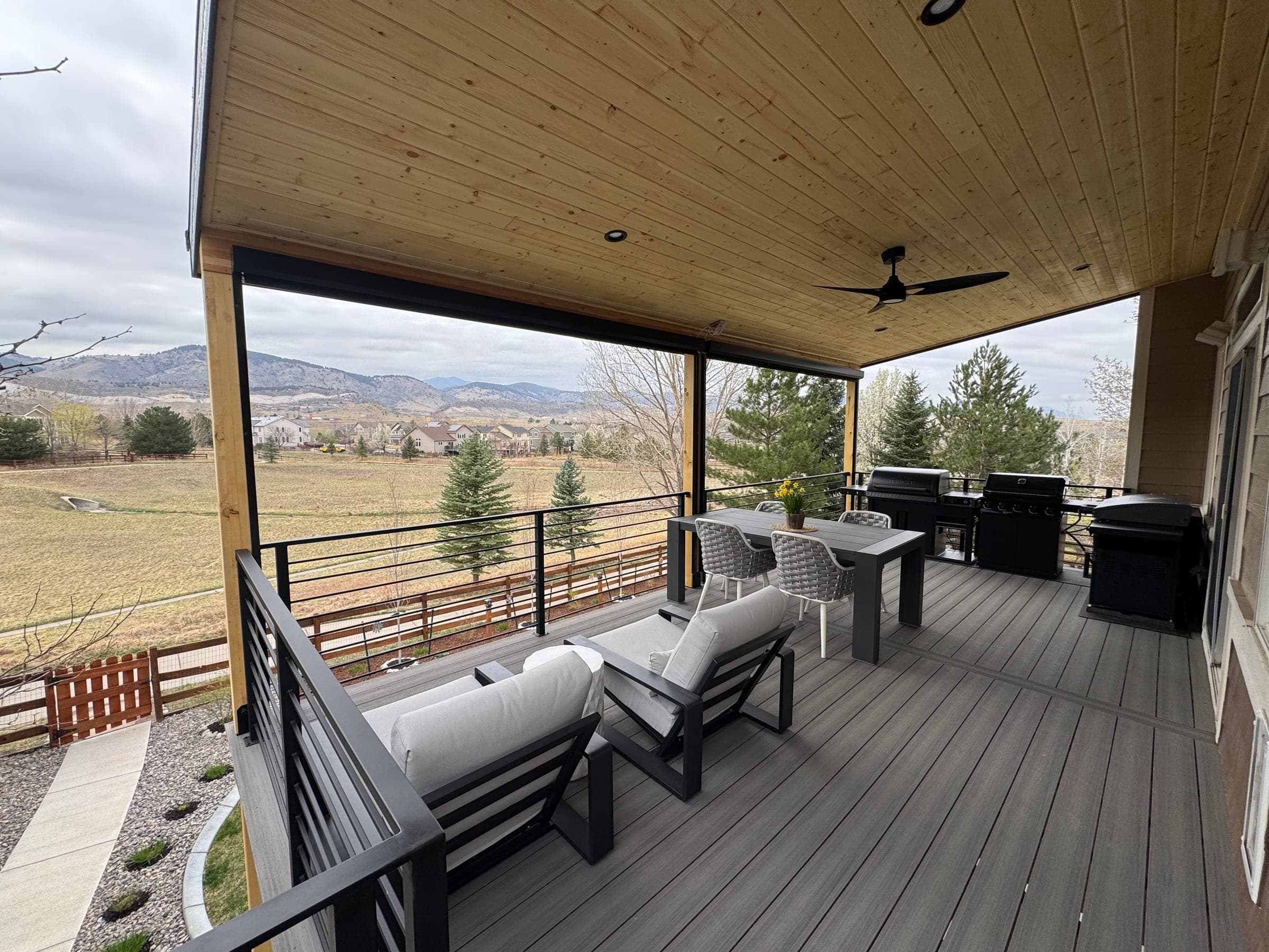 Covered Deck with Spiral Staircase in Greenwood Village, CO — gallery photo 10